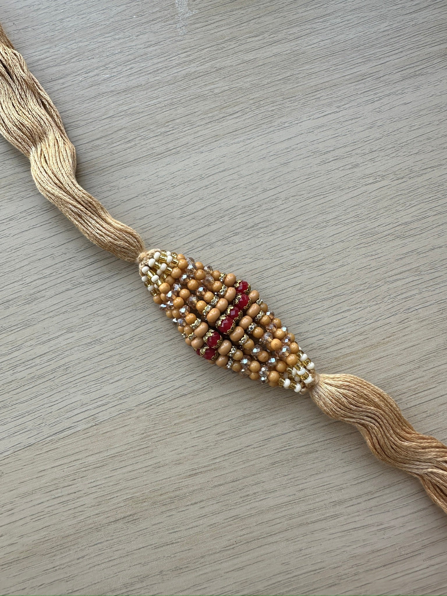 raksha bandan, rakhi, rakhri, red stones, iridescent stones, white stones, nude string 