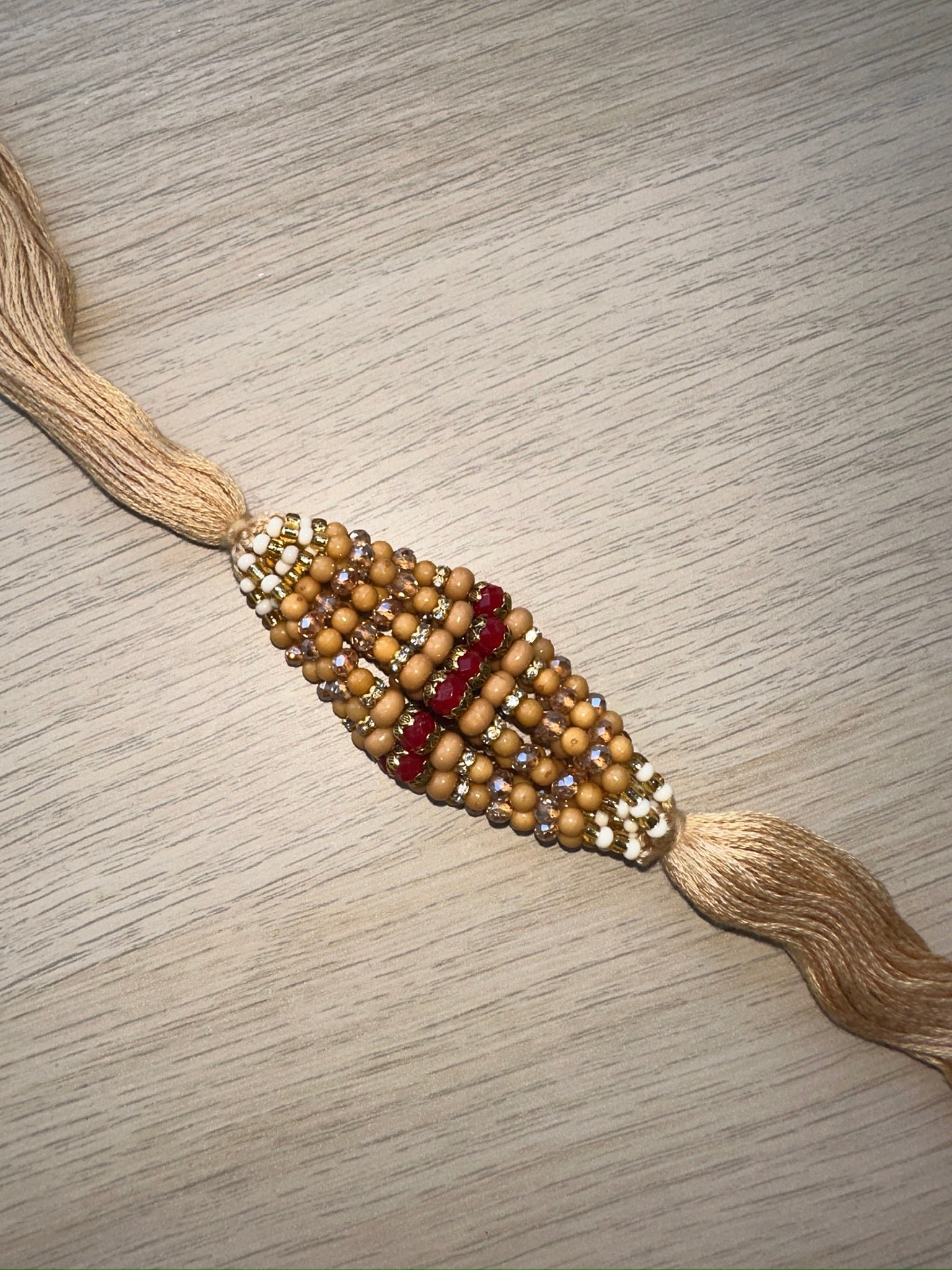 raksha bandan, rakhi, rakhri, red stones, iridescent stones, white stones, nude string 